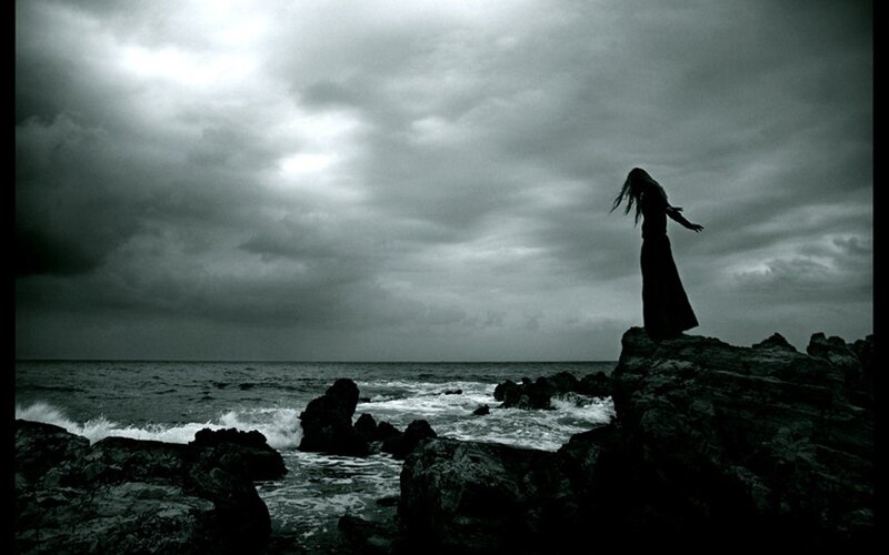 Silhouette of Person on Rocks