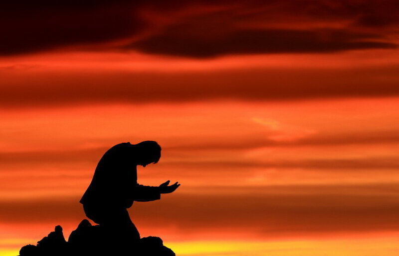 Silhouette of Person Praying