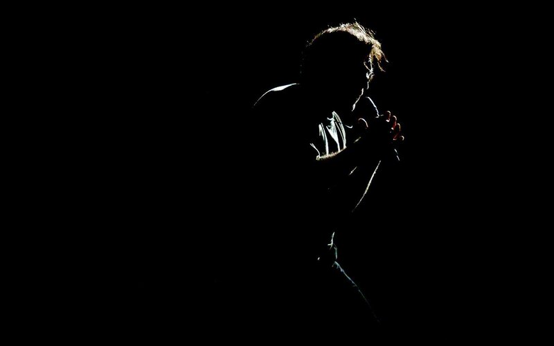 Silhouette of Person Singing