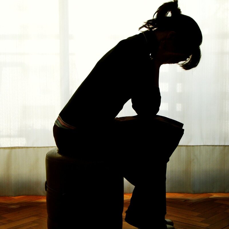 Silhouette of Person Sitting — Black, Somber, Photograph