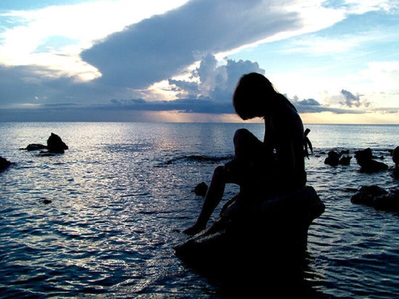 Silhouette of Person Sitting — Blue, Dramatic, Sunset
