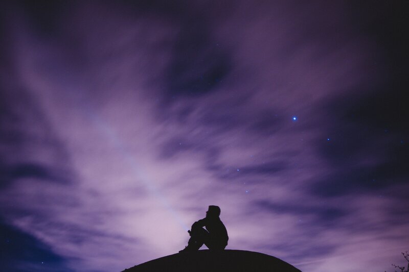 Silhouette of Person Sitting — Purple, Serene