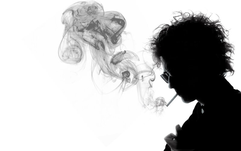 silhouette of person smoking