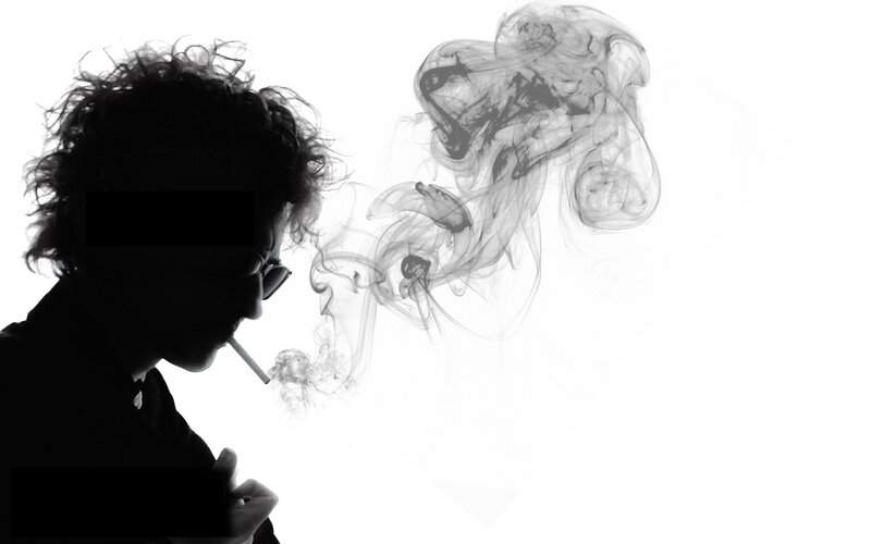 silhouette of person smoking