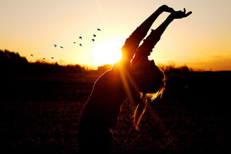 Silhouette of Person Stretching