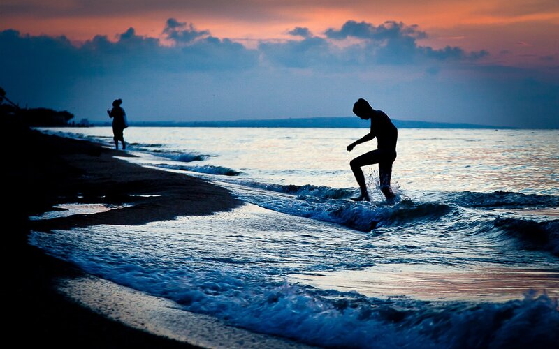 Silhouette of Person Surfing