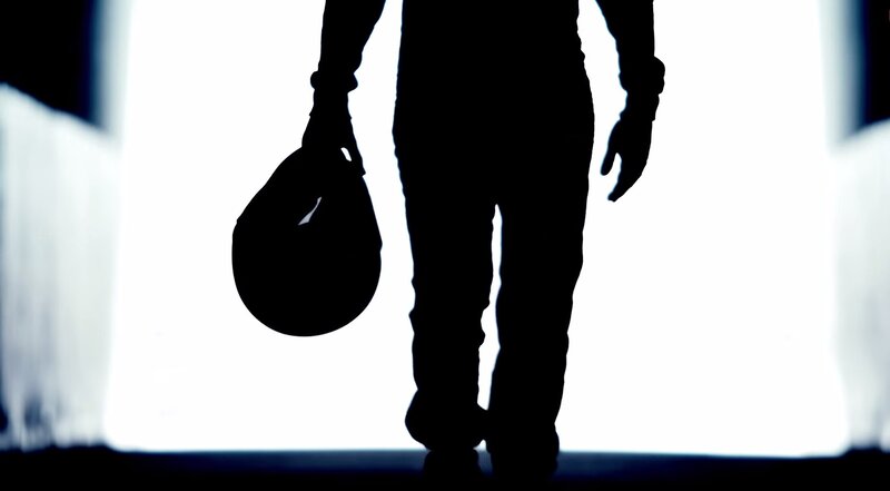 Silhouette of Person Walking — Black, Dramatic, Photograph, Helmet