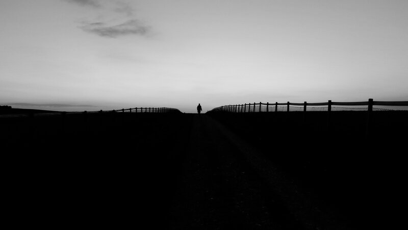 Silhouette of Person Walking — Black, Solitary