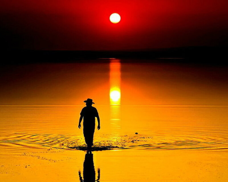 Silhouette of Person Walking — Red, Dramatic, Sunset