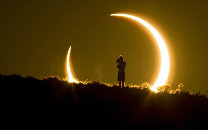 Silhouette of Person Watching Eclipse — Yellow, Dramatic
