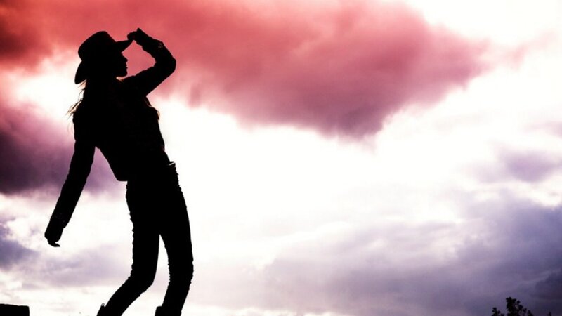 Silhouette of Person Wearing Hat