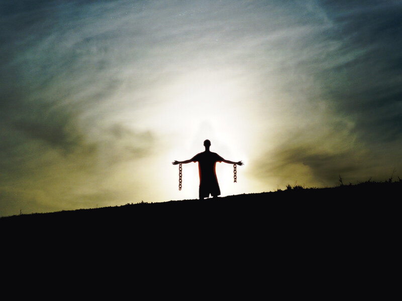 Silhouette of Person with Chains