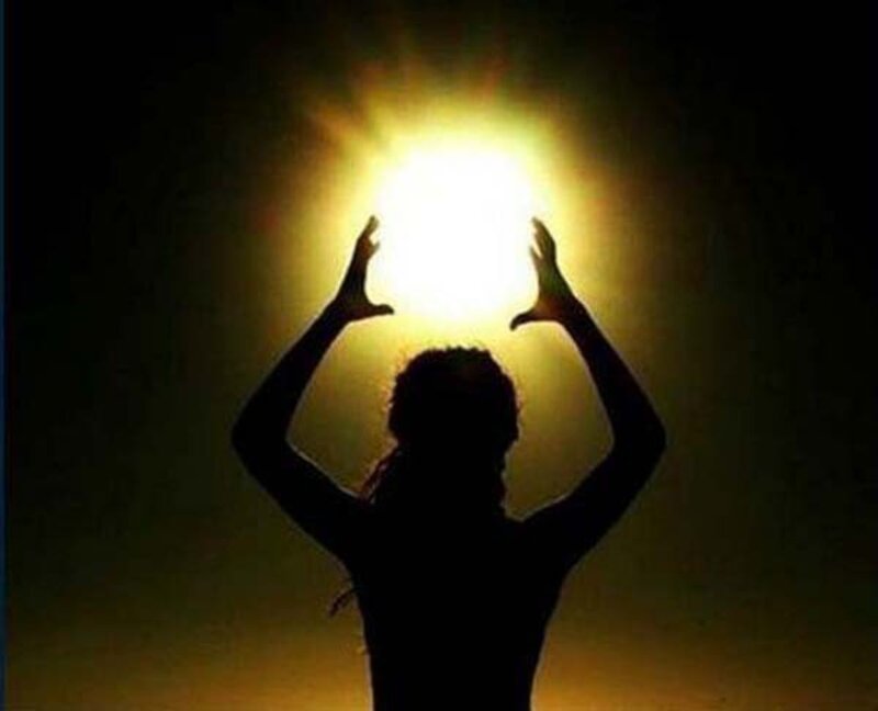 Silhouette of Person with Hands Up