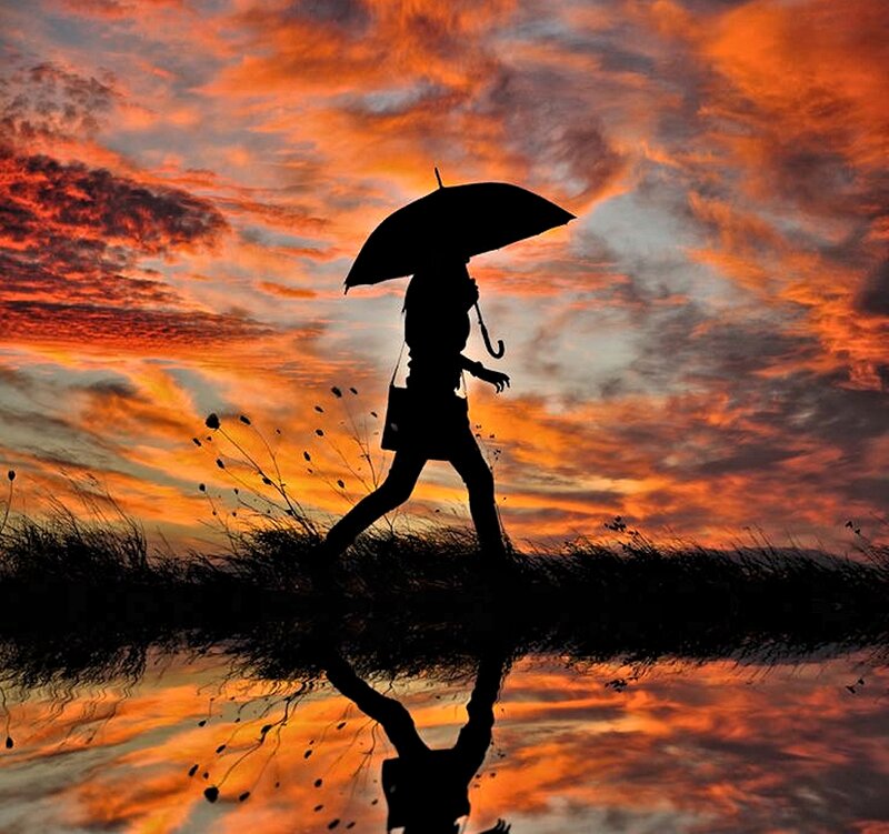 Silhouette of Person with Umbrella — Orange, Dramatic, Sunset, Photograph, Reflection