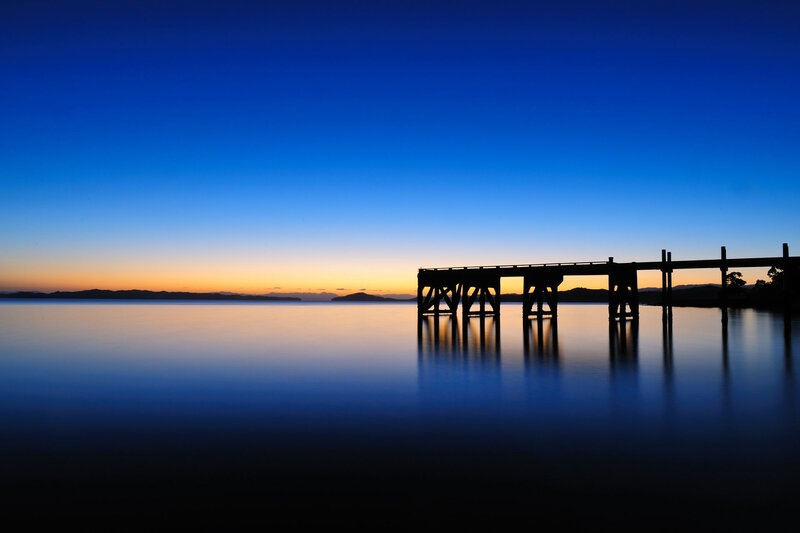 Silhouette of pier at dusk