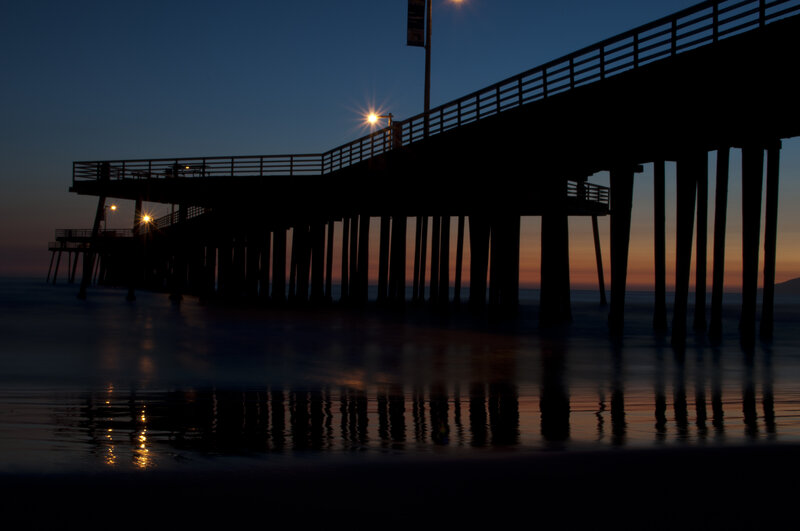 silhouette of pier at dusk