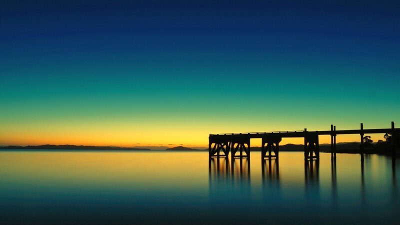 Silhouette of pier at sunset