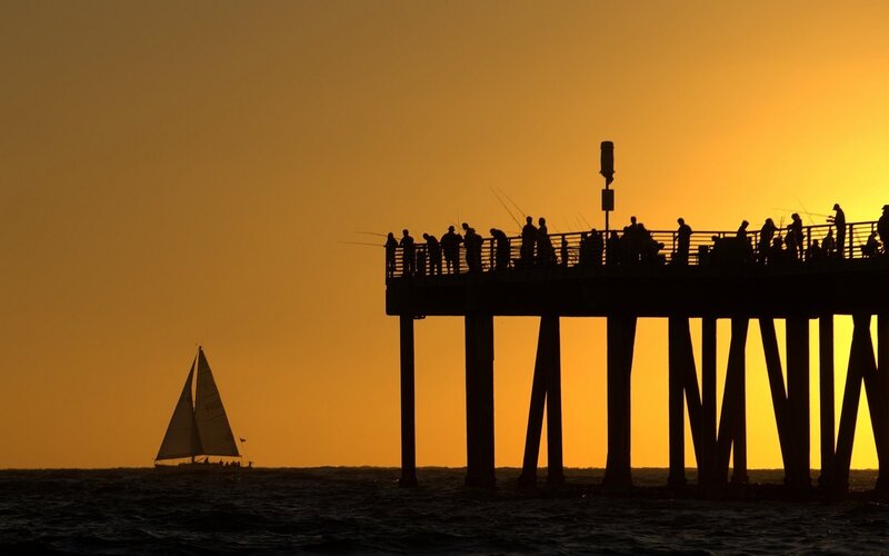 silhouette of pier at sunset