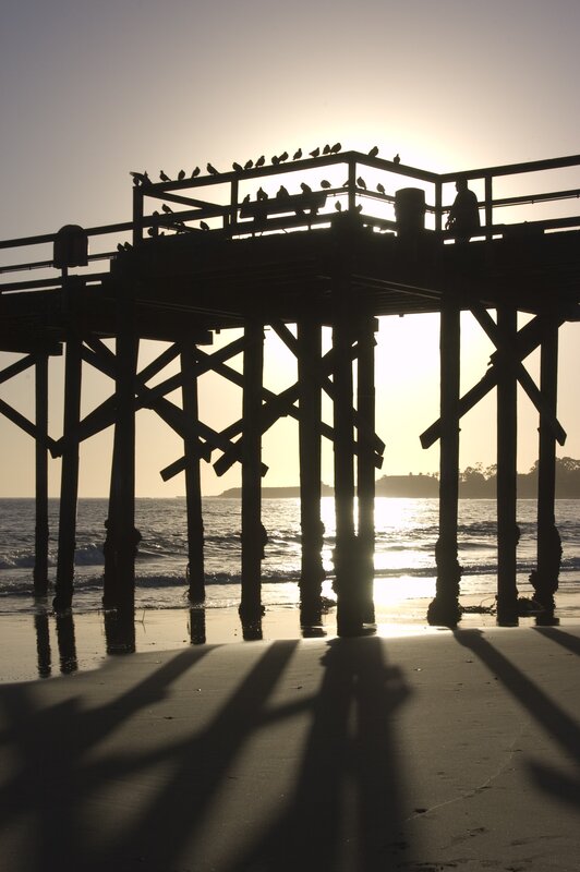 silhouette of pier at sunset