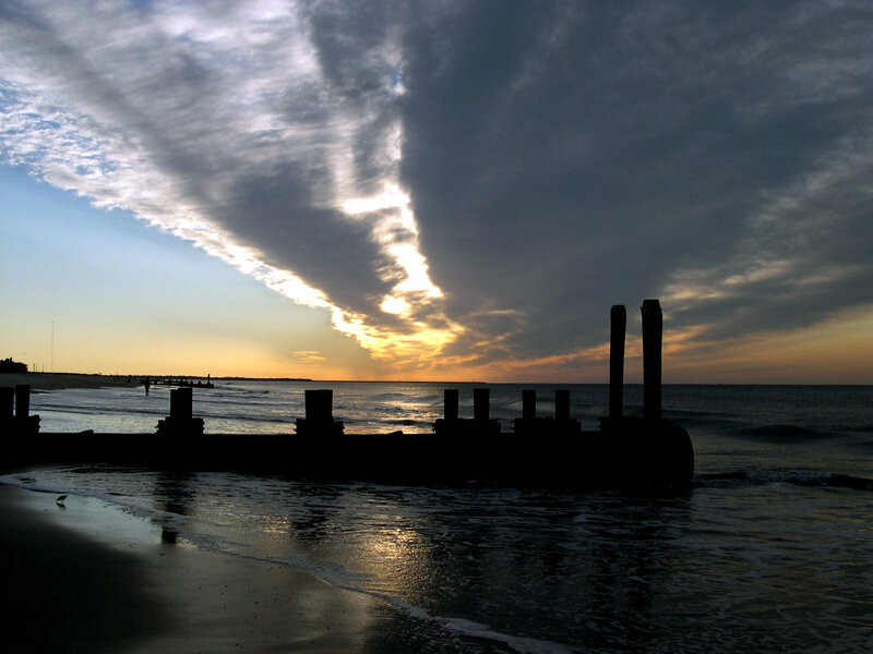 silhouette of pier at sunset