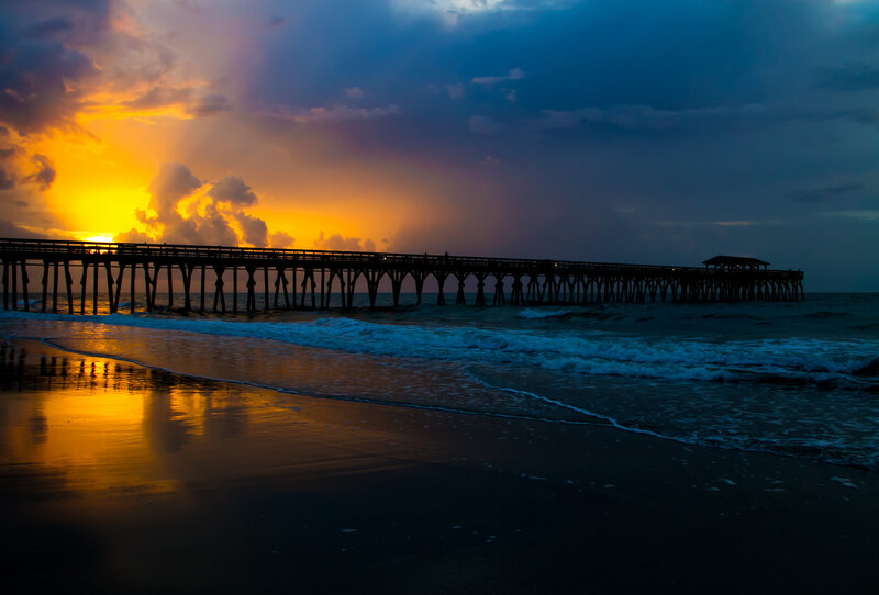 Silhouette of Pier at Sunset — Orange, Dramatic, Photograph, Ocean, Sky, Beach