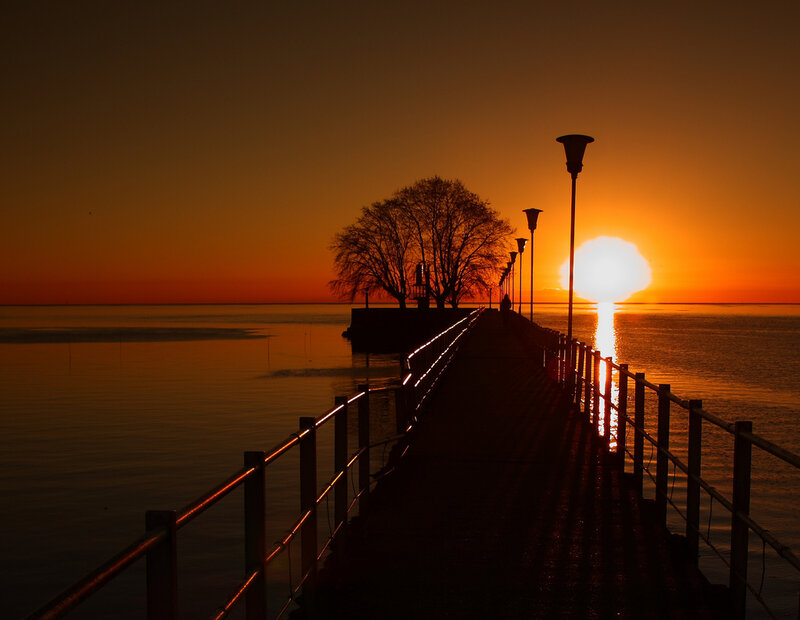 Silhouette of Pier at Sunset — Orange, Serene, Photograph, Tree