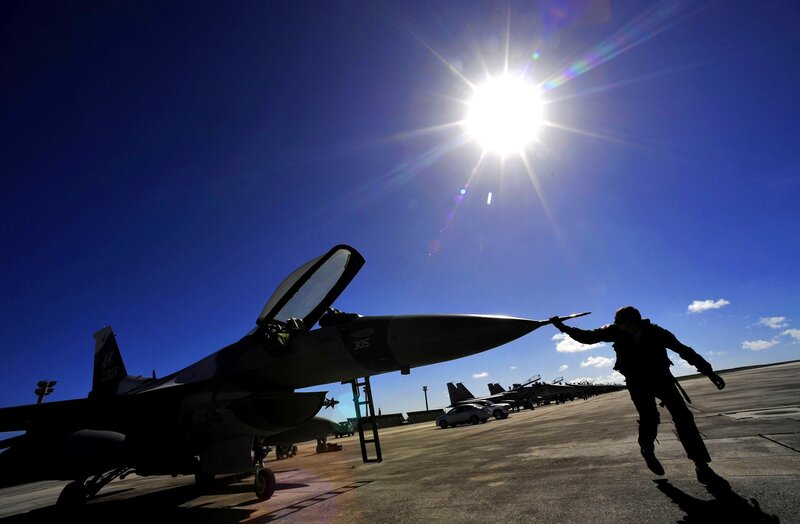 Silhouette of Pilot and Jet — Blue