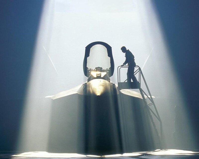 silhouette of pilot and jet