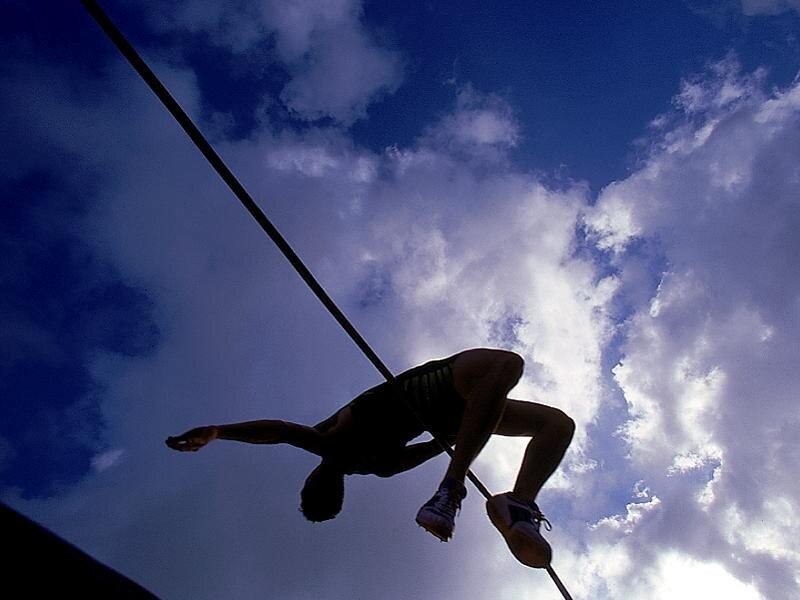 Silhouette of pole vaulter in action