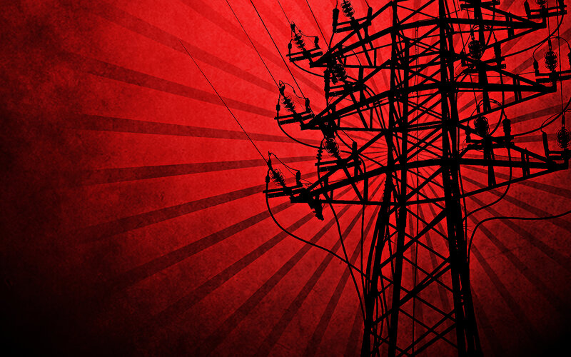 silhouette of power line tower