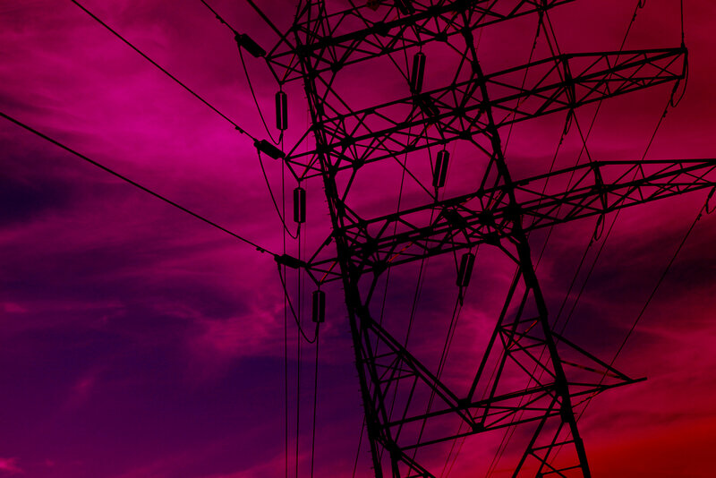 Silhouette of power lines at sunset