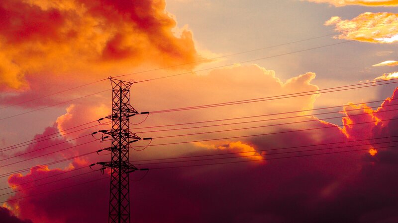 Silhouette of Power Pole — Orange, Dramatic