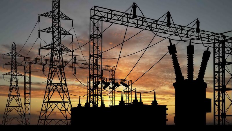 silhouette of power station at sunset