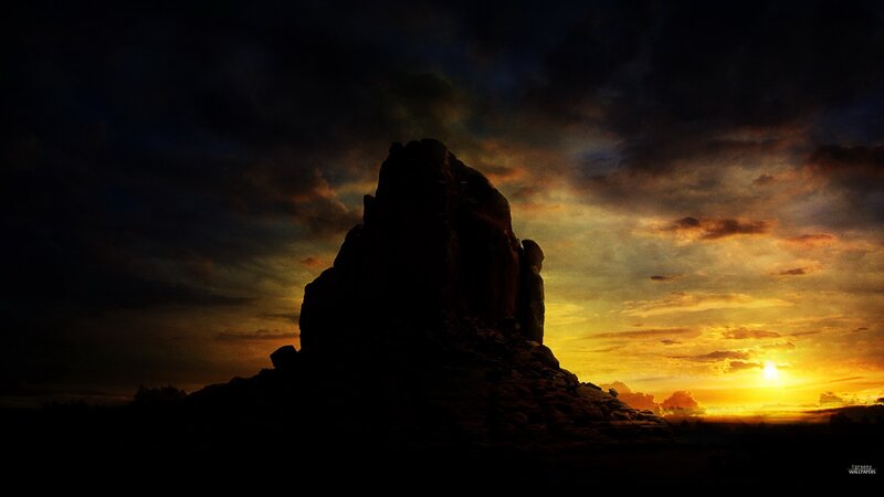 Silhouette of rock at sunset