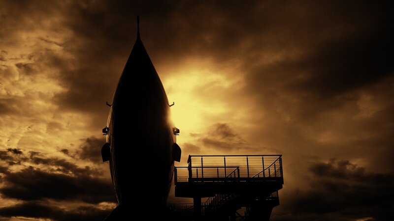 silhouette of rocket at sunset