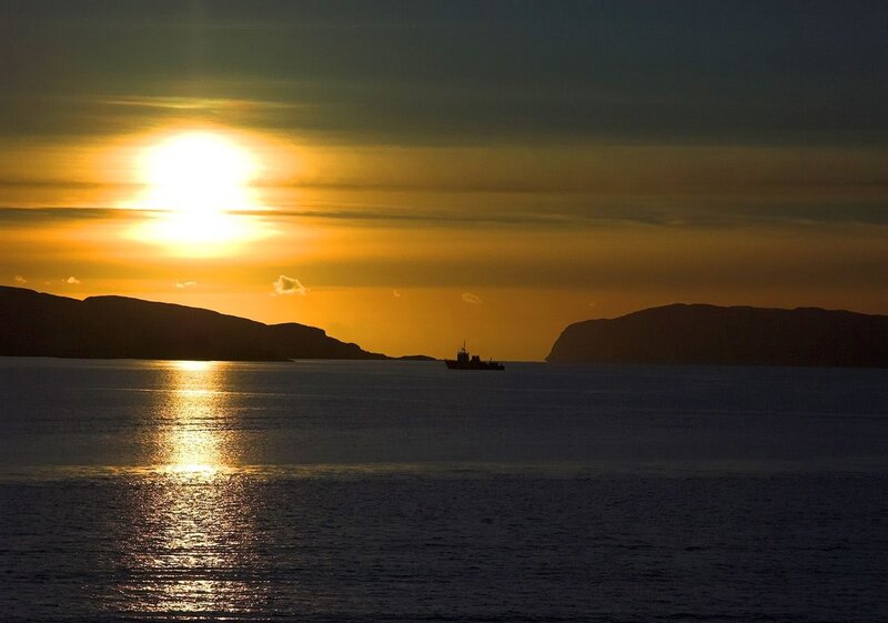 Silhouette of Ship at Sea