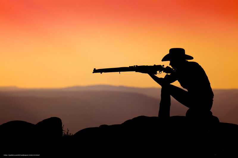 silhouette of shooter at sunset