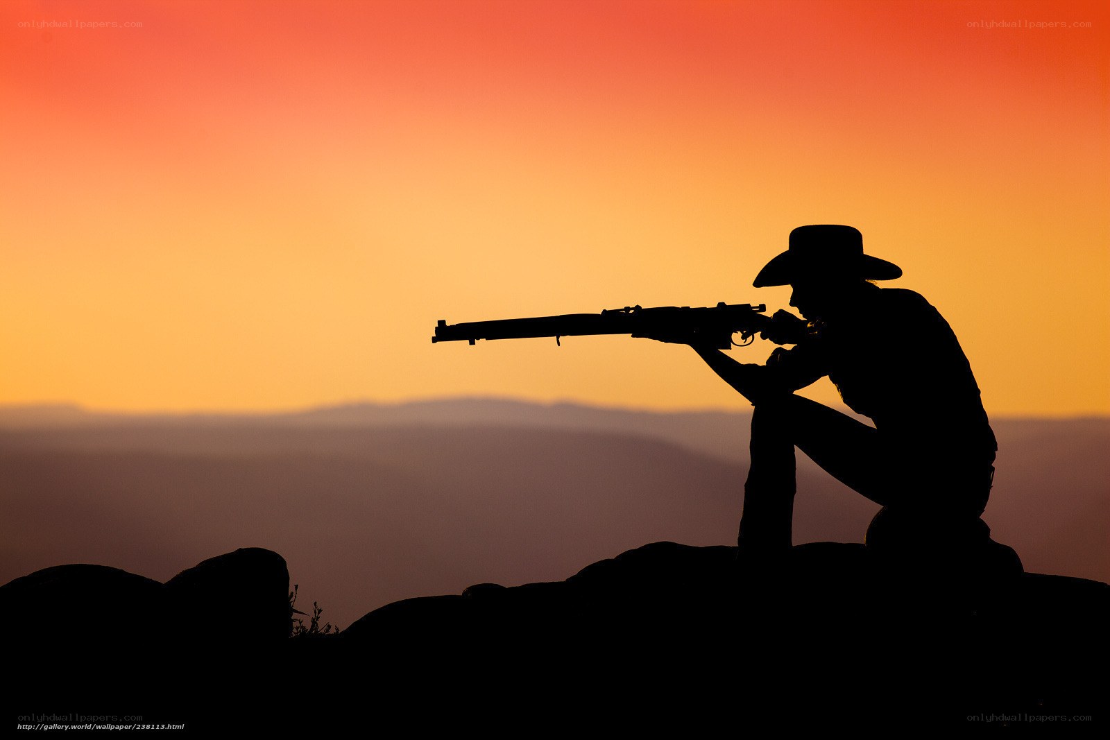 silhouette of shooter at sunset