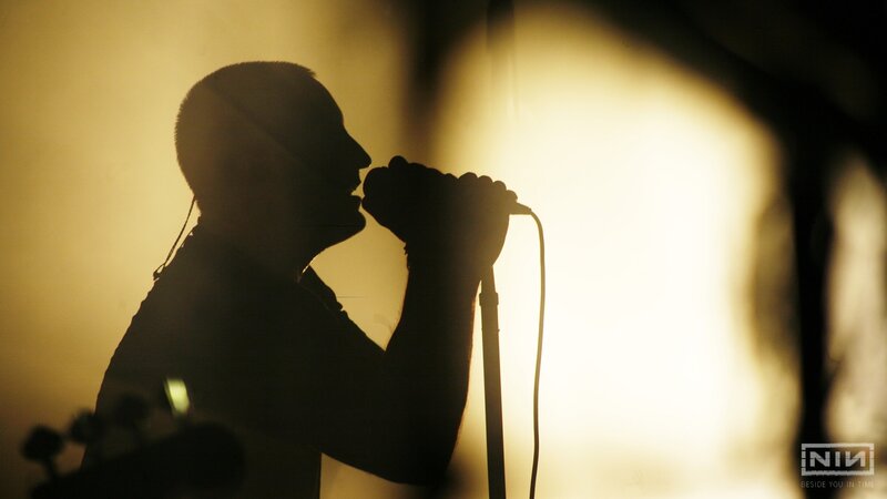 silhouette of singer on stage