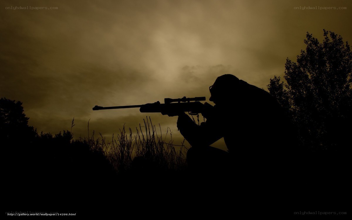 silhouette of sniper at dusk