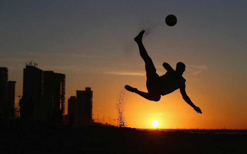 Silhouette of Soccer Player — Orange, Dramatic