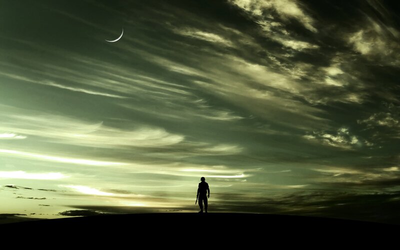 Silhouette of soldier under crescent moon