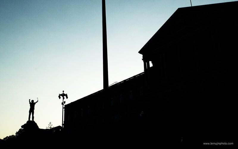 silhouette of statue at dusk