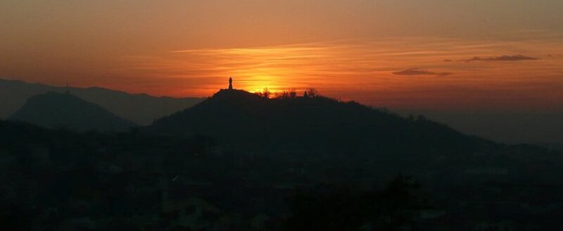 Silhouette of Statue on Hill