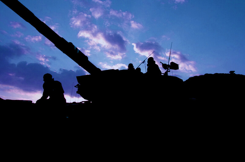 Silhouette of tank at dusk