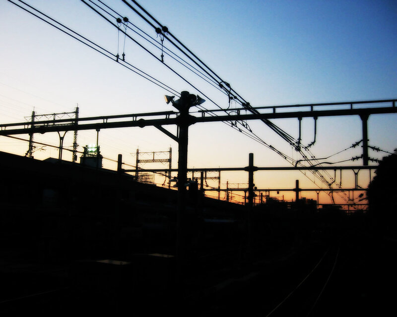 silhouette of train tracks at sunset
