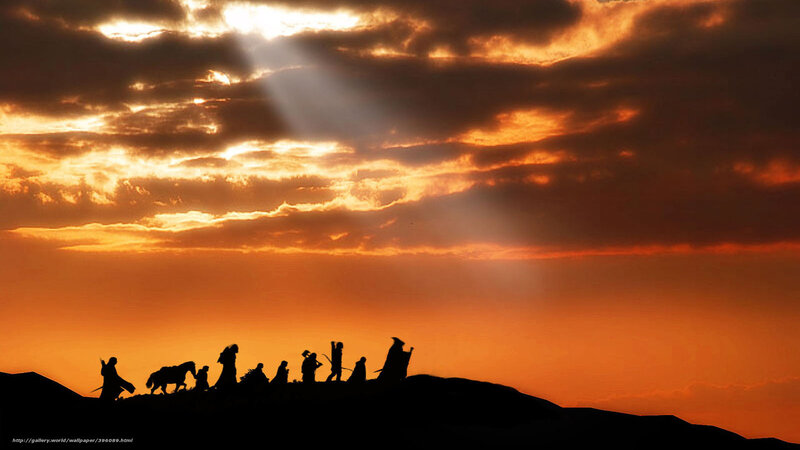Silhouette of travelers at sunset