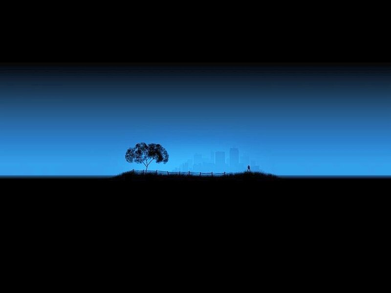 Silhouette of tree and city skyline