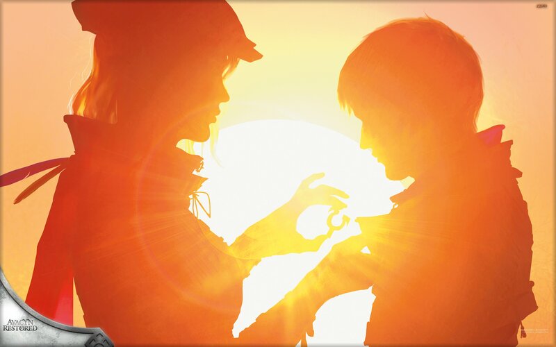 Silhouette of two figures at sunset