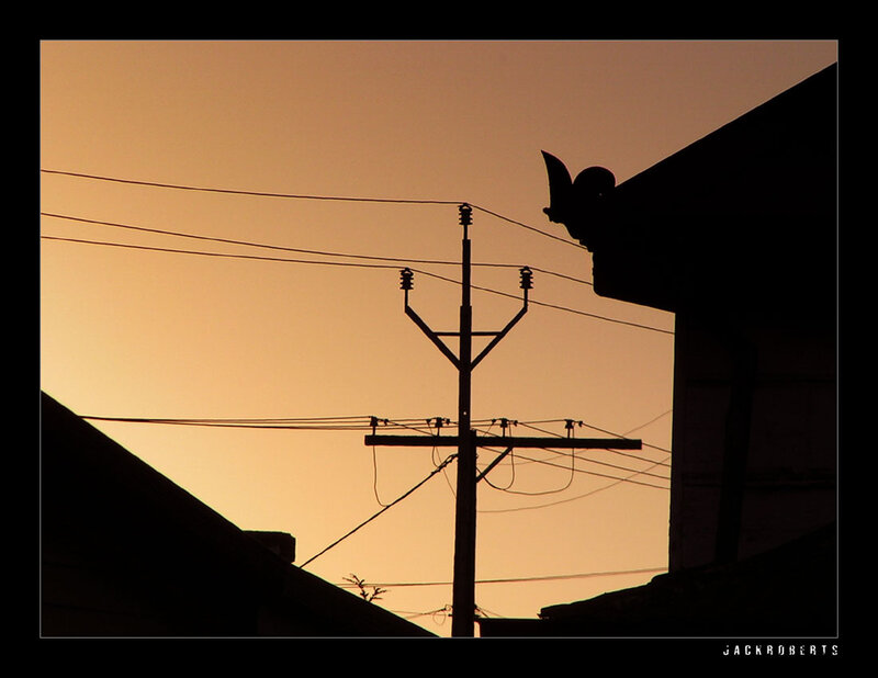 Silhouette of Utility Pole — Orange, Dramatic